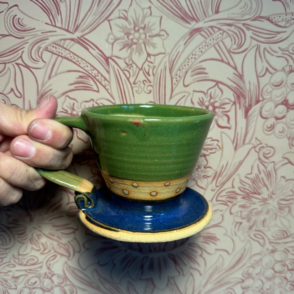 Handmade pottery ceramic mug with a flat bottom. Signed